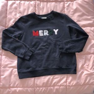 Navy blue crew neck medium sweatshirt with ‘MERRY’ logo
